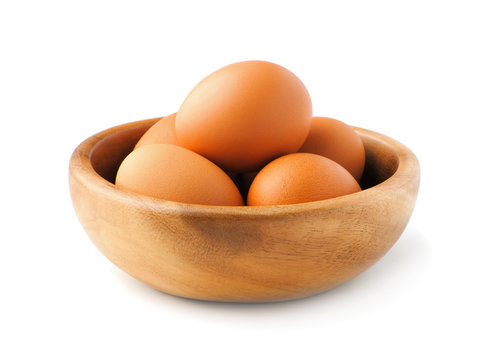 Chicken eggs in the wooden plate  isolate on white