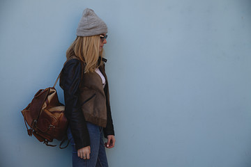 Fashion girl of casual stylish woman on a blue background.