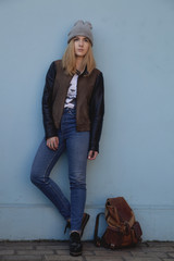 Fashion girl of casual stylish woman on a blue background.