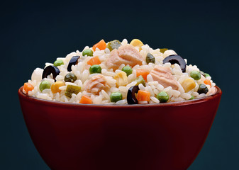 Bowl with rice salad with vegetables and tuna