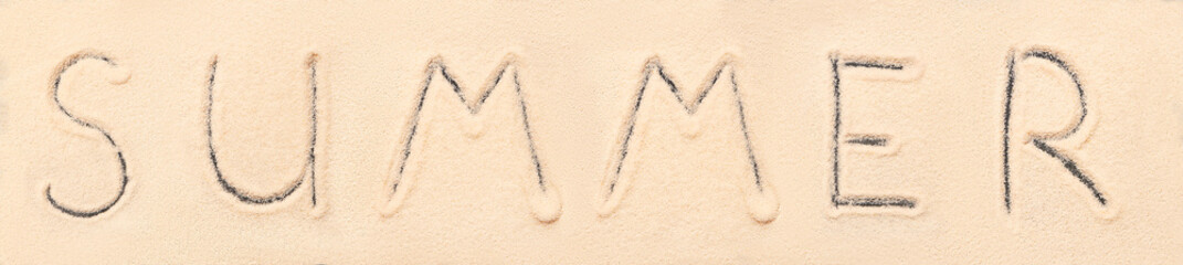 Summer lettering drawn on sand