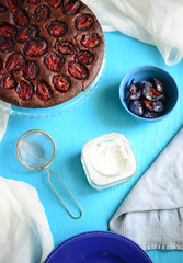 Plum cake on blue background