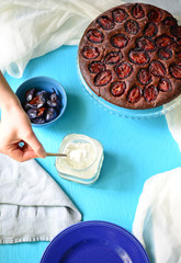 Plum cake on blue background