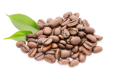Coffee grains and leaves isolated on the white backgrounds.