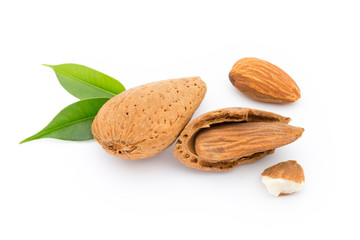 Almonds with leaves isolated on white background