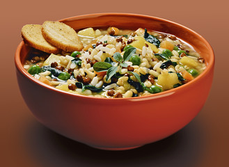 Orange bowl with cereals and vegetable lentils soup with crouton