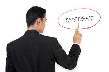 Businessman pointing at "Insight"