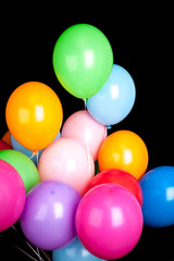 Fototapeta na wymiar Group of colorful balloons isolated on black