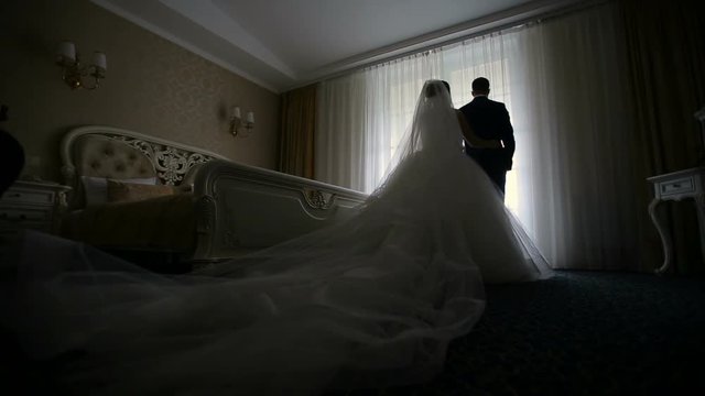 Bride comes groom at back