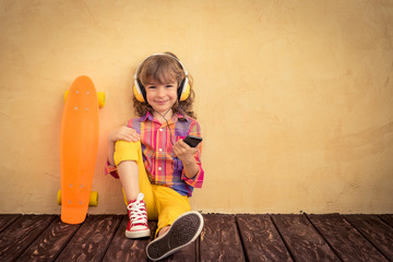 Hipster child with skateboard © Sunny studio