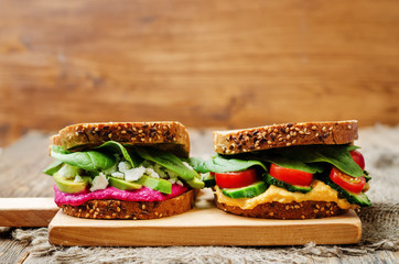 rye sandwiches with carrots and beetroot hummus and vegetables