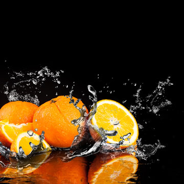 Orange fruits and Splashing water