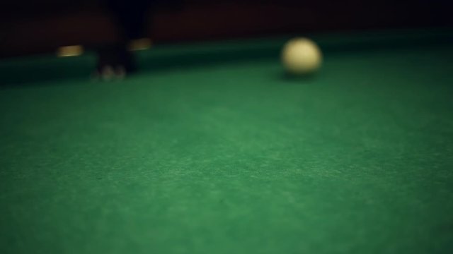 Billiards table and balls, strike the cue ball and falling in the pocket
