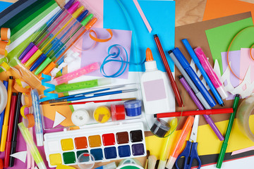 artwork workplace with creative accessories, art tools for painting and drawing