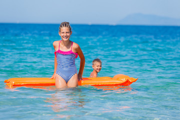 Kids playing in sea. 