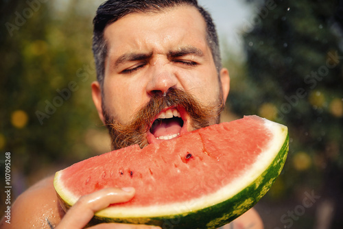 bearded man without clothes with a <b>big juicy</b> ripe watermelon in hands on a ... - 500_F_107095268_bW96Sm4Jcf1Qxiui0WMWrrBFCgyqojLG