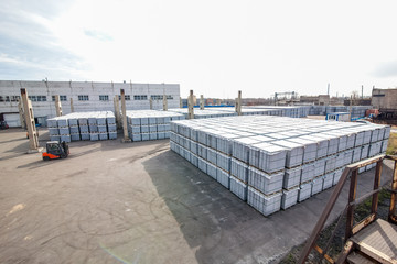 Stack of concrete blocks near house-building factory
