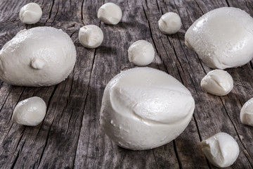 mozzarella balls on a wooden table, close-up