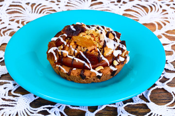 Homemade Cakes: Cake on Plate with Nuts, Chocolate and Raisins.