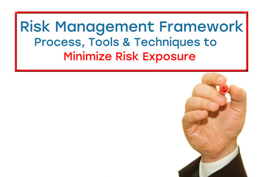 Businessman hand writing Risk Management Framework. Process, Tools & Techniques to Minimize Risk Exposure. Risk Management concept.