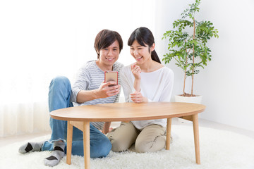 young asian couple using smart phone