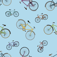 Vector seamless pattern with colorful bicycles on blue background