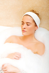 Young woman relaxing in bath