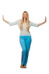 Young woman wearing blue training pants isolated on white