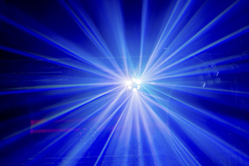 Light rays from a stage lighting show