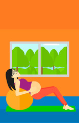 Pregnant woman on gymnastic ball.
