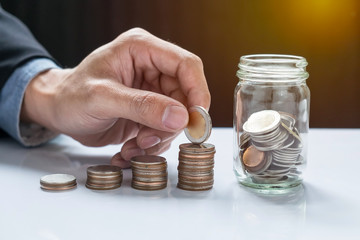 filling up coins to coin piles and glass for investment in the f