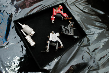 Set of tattoo machines and devices at black box