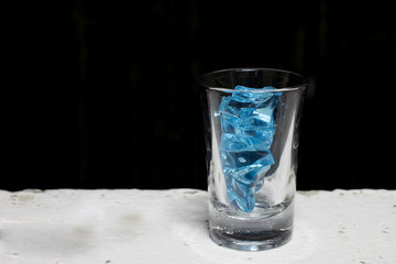 Blue Ice in shot glass.