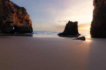 Sunset at rocky coastline of Atlantic ocean