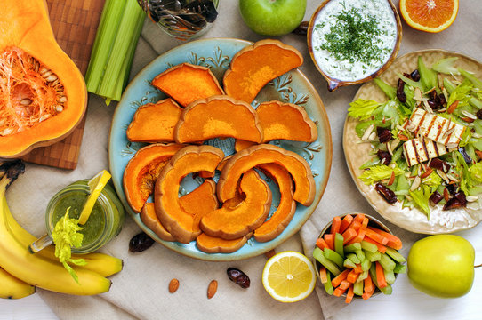 Healthy lunch salad, tzatziki and baked pumpkin