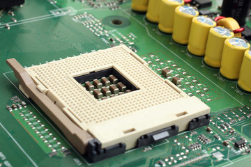 motherboard close up with resistors and chips