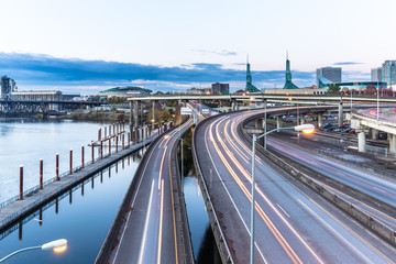 traffic on road with cityscape and skyline of portland