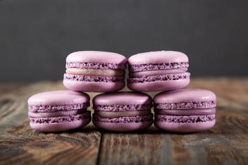 Still life with tea and delicious sweet blueberry macarons