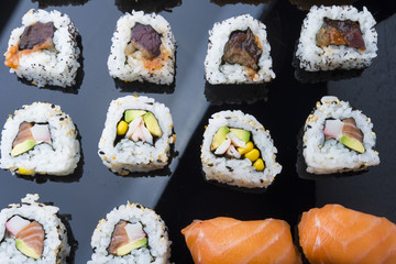 Sushi set isolated on black background
