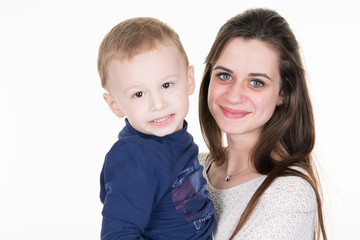 Young mom and her baby boy isolated on white