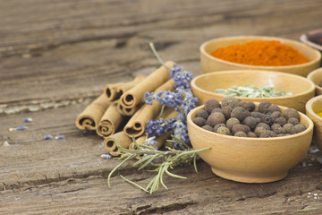 Variety of spices on wooden background