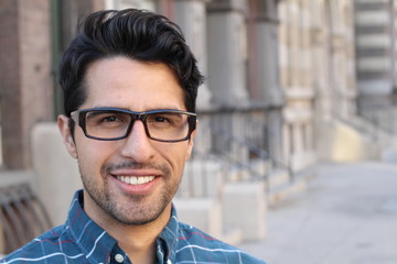 Handsome smiling confident man portrait with copy space on the right 