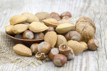 nuts on old wooden background