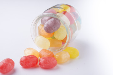 Multicolor candies in glass jars