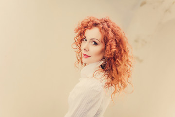 young girl ginger hair posing in the street