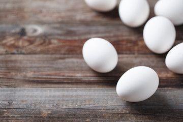 White eggs on the old wood table