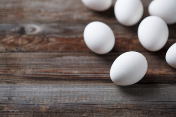 White eggs on the old wood table
