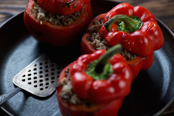 Close-up of baked bell peppers stuffed with minced meat and rice