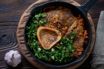 Top view of ossobuco made of cross cut veal shank with gremolata