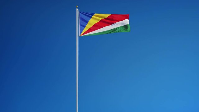 Seychelles flag waving in slow motion against clean blue sky, seamlessly looped, long shot, isolated on alpha channel with black and white luminance matte, perfect for film, news, digital composition